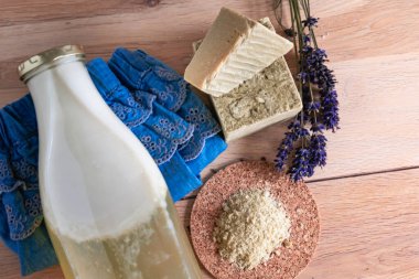 Bottles of homemade laundry on a table, Marseille grated soap, DIY, do it yourself, zero waste, eco friendly, natural product for wash and cleaning