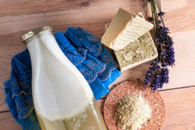 Bottles of homemade laundry on a table, Marseille grated soap, DIY, do it yourself, zero waste, eco friendly, natural product for wash and cleaning