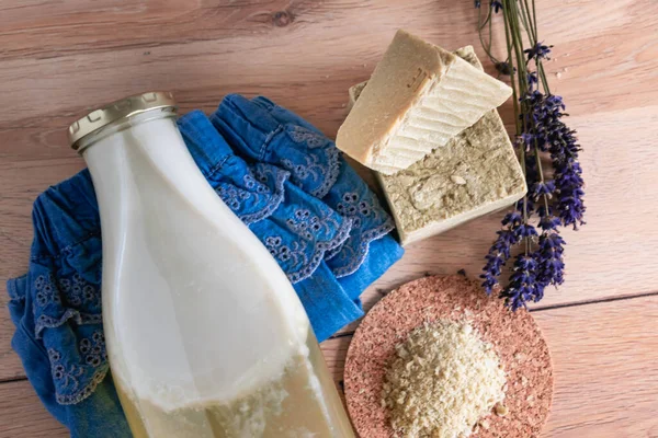 Bottles of homemade laundry on a table, Marseille grated soap, DIY, do it yourself, zero waste, eco friendly, natural product for wash and cleaning