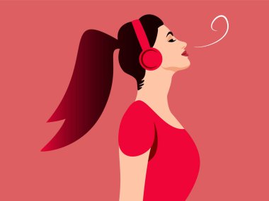 Kahverengi ve pembe saçlı, kulaklıklı bir kadın solunum egzersizi yapıyor.