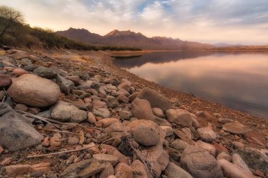 A view from the rocky shoreline of Horseshoe Reservior in the Tonto National Forest  near Cave Creek, Arizona clipart