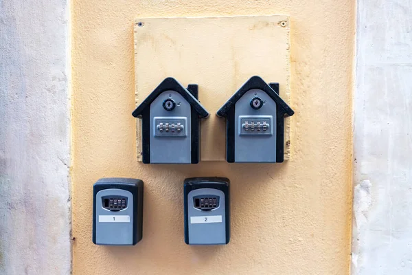Outdoor apartment Safe Key Box home rent To Retrieve Keys in wall entrance door rental.