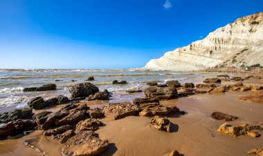 View of the limestone white cliffs with the beach at Stair of the Turks or Turkish Steps near Realmonte in Agrigento province. Sicily, Italy