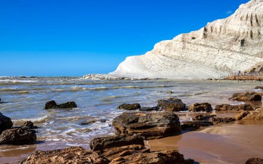 View of the limestone white cliffs with the beach at Stair of the Turks or Turkish Steps near Realmonte in Agrigento province. Sicily, Italy