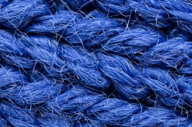 The macro texture of the blue cotton fiber cloth.
