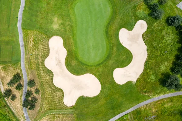 stock image Landscape in a golf course an aerial view of a green field, lawn, and grass. Design for golfers to play games, sports, and outdoor recreation activities.