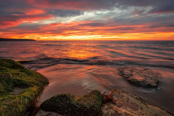 Amazing red sunrise over the sea.	