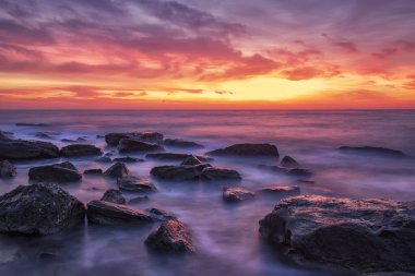 Stunning red sunrise over the sea.	