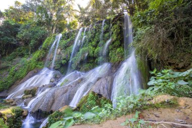 El Nicho Waterfalls in Cuba. El Nicho is located inside the Gran Parque Natural Topes de Collantes a forested park that extends across the Sierra Escambray mountain range in central Cuba. clipart