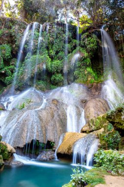 El Nicho Waterfalls in Cuba. El Nicho is located inside the Gran Parque Natural Topes de Collantes a forested park that extends across the Sierra Escambray mountain range in central Cuba. clipart