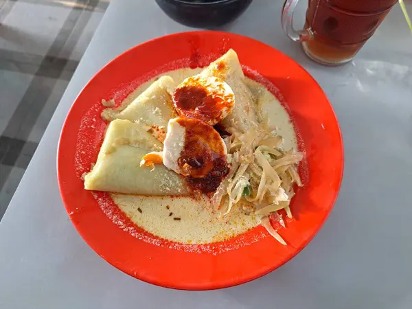 stock image Vegetable lontong with coconut milk sauce with salted egg side dish traditonal food from indonesia