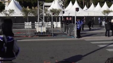 Carnival flower parade in Nice. A beautiful and noisy holiday on the azure coast. Giant dolls, flower battles. A crowd of people at the festival. People on horseback.