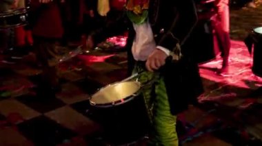 Carnival in Nice. Parade of light. Colorful images in masks. Tourists from all over the world. Parade of platforms. Papier-mch dolls, platform movement. The guy plays the drum