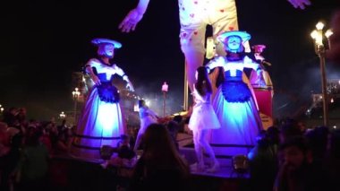 Carnival in Nice. Parade of light. Colorful images in masks. Tourists from all over the world. Parade of platforms. Papier-mch dolls, platform movement. Young dancers