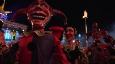 Carnival in Nice. Parade of light. Colorful images in masks. Tourists from all over the world. Parade of platforms. Papier-mch dolls, platform movement.