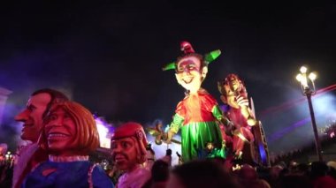 Carnival in Nice. Parade of light. Colorful images in masks. Tourists from all over the world. Parade of platforms. Papier-mch dolls, platform movement.