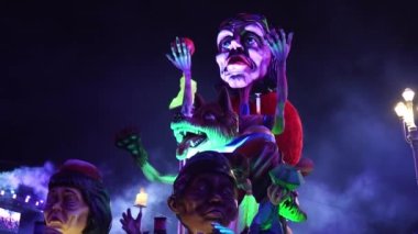 Carnival in Nice. Parade of light. Colorful images in masks. Tourists from all over the world. Parade of platforms. Papier-mch dolls, platform movement.