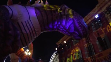 Carnival in Nice. Parade of light. Colorful images in masks. Tourists from all over the world. Parade of platforms. Papier-mch dolls, platform movement.