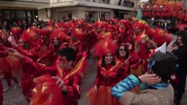 Carnival in the city of Viareggio. A parade of giant cartoon papier-mch installations. Millions of spectators, crowds of tourists. Dancers and artists in carnival costumes