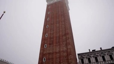 St. Mark's Square. The main city square of Venice, Italy. Bell tower in the city center. A drowning city in fog.
