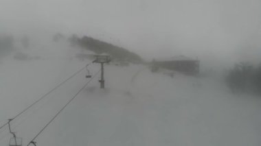 Shot from the drone of the funicular to the Himba mountain. Ski resort Pylypets in the Carpathians of Ukraine. Prepared tracks for skiers and snowboarders. The longest ski run in Ukraine. Cableway