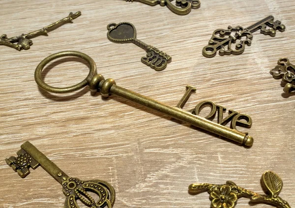 stock image Vintage love keys on the wooden bacground.