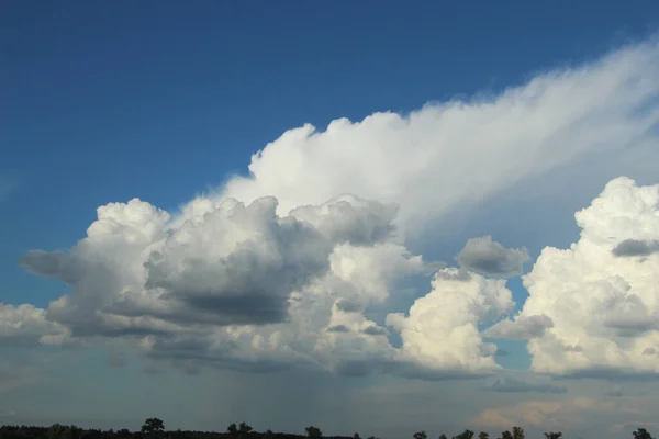 stock image Fluffy, white clouds on the blue sky of Ukraine