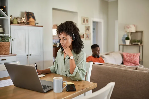 Young African Woman Wearing Headset Working Home Laptop Her Husband — 图库照片