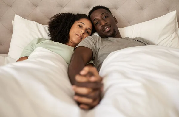 Portrait Loving Young Multiracial Couple Holding Hands While Lying Together — Stock Photo, Image