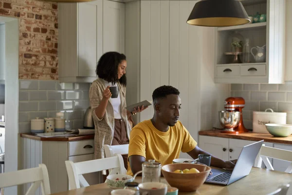Young Multiethnic Couple Reading Working Laptop While Having Breakfast Kitchen — Stock Photo, Image