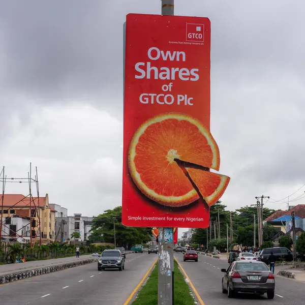 stock image A street light pole advert for the sales of GTCO Plc shares in the Lekki area of Lagos, Nigeria, July 20 2024. Simple investment for every Nigeria