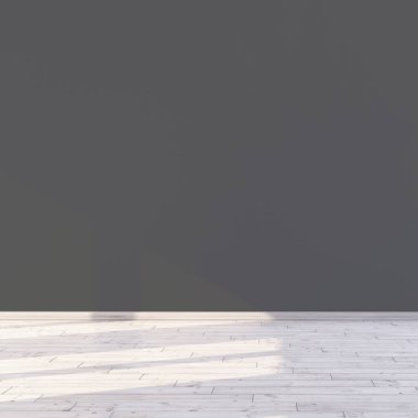 Pencerenin içinden güneş ışığı geçen bir odada boş, koyu gri bir duvar..