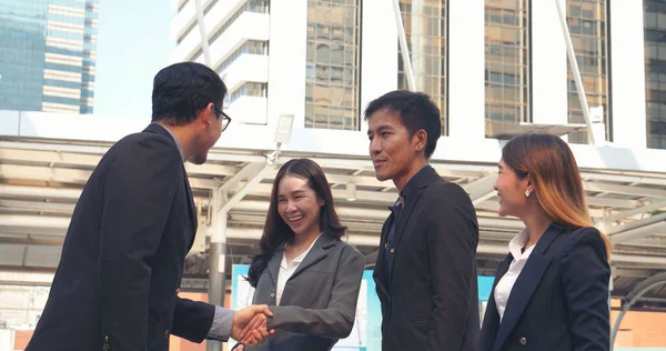 stock image Diversity Business Partner meeting trust in teamwork and partnership businessman, businesswoman talking together in modern city. Asian coworker team meeting with Business People Working Together Team