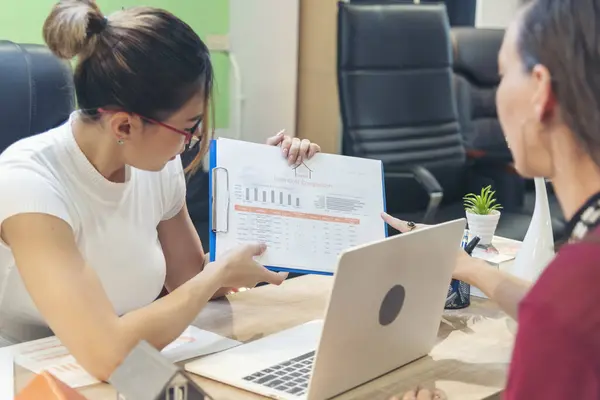 Two businesspeople meeting work at office desk. Teamwork partners team with Business strategy chart graph, infographic data financial report. Team partner planning marketing finance excel stat report