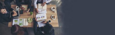 Banner top view business people meeting together at office desk in conference room. Panorama Team business meeting partnership plan brainstorm together. Team Collaborate partner group with copy space