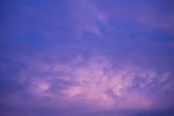 Violet purple sky in morning scenery Vibrant colorful blue sky summer time on sunrise. Natural beautiful landscape. Beauty purple sky romantic dramatic landscape cloudy outdoor paradise in sunset