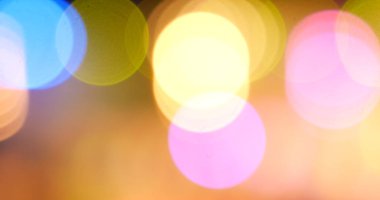 Renkli Bokeh soyut bulanık arka plan müzik festivali sahne performansı partisi. Canlı arka plan kıvılcımları animasyon hareketini ateşliyor. Göz kırpan gece hayatı ile sahne arkası görüntüsü yanıp sönen ışık