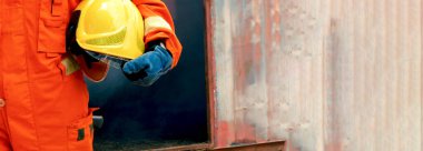 Firefighter Rescue training in fire fighting extinguisher. Firefighter fighting with flame using fire hose chemical water foam spray engine. Fireman wear hard hat, safety suit uniform for protection