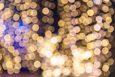 Altın Noel süsü, parlak arka plan bulanıklığı. Altın parıltılı, parlak Noel Işıkları pankartı. Yılbaşı kartı şablonu için iyi tatiller. Altın bokeh sunumu..