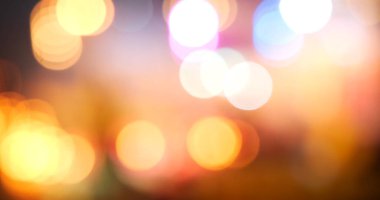 Renkli Bokeh soyut bulanık arka plan müzik festivali sahne performansı partisi. Canlı arka plan kıvılcımları animasyon hareketini ateşliyor. Göz kırpan gece hayatı ile sahne arkası görüntüsü yanıp sönen ışık