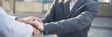 Banner Trust honesty business customer handshake together promise partner. Panorama Businessman teamwork diversity solidarity team Partner hands together. Team meeting shaking hands with copy space