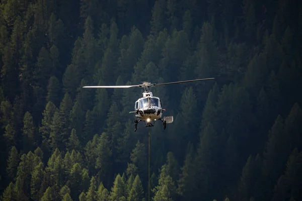 Close Helicopter Flying Forest Attached Transportastion Rope Swiss Alps — Stock Photo, Image