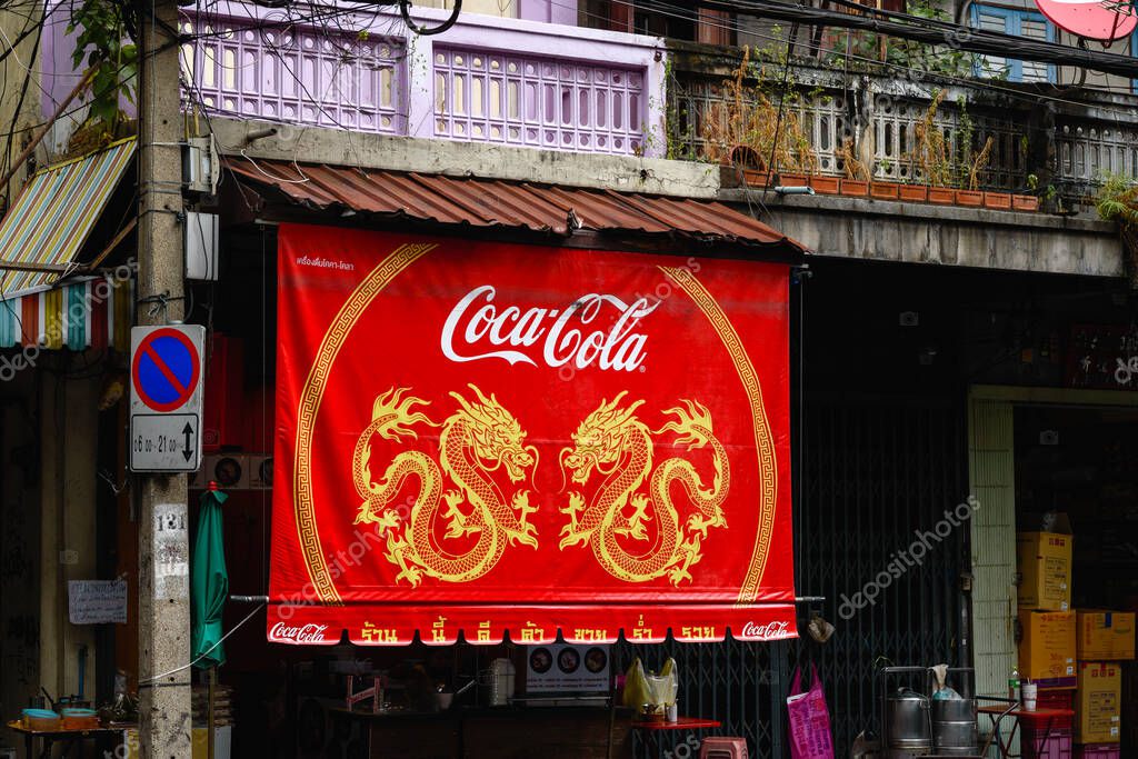 Red Coca Cola sign with two dragons in Chinatown Bangkok