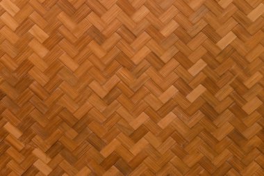 Orange weaved bamboo pattern. Background texture, close up photo.