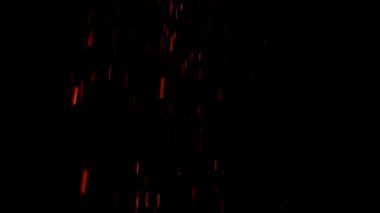 Red embers falling down slow motion, black background loop.