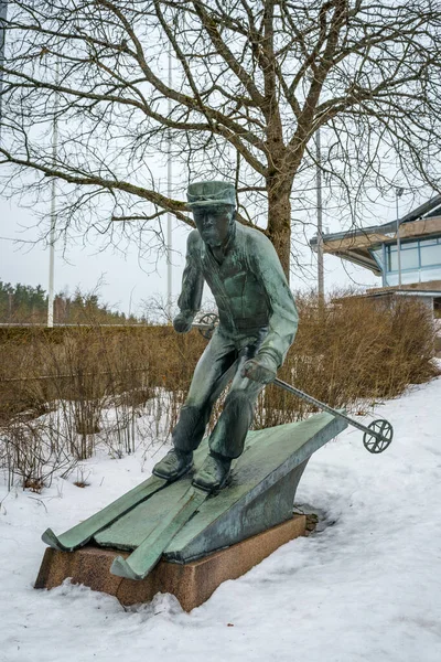 stock image Bronze sculpture of a skier at the Lahti Sports Centre in winter, Finland. March 19, 2023.
