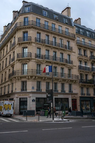 stock image French Flag on pole in the street of Paris, France. March 24, 2023.