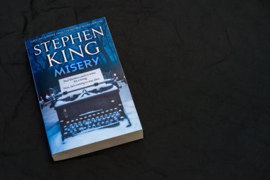 Misery by Stephen King on dark surface. Lahti, Finland. June 18, 2023. clipart