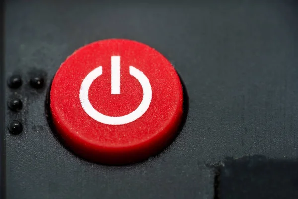 stock image Red power button of a TV remote, close up macro.