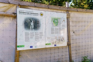 Ikaalinen, Finland. September 7, 2024 - Sign outside the wild forest reindeer enclosure in Seitseminen National Park clipart